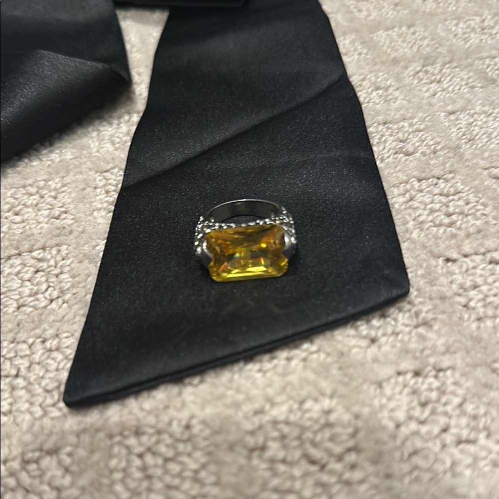 Elegant Black Tie with Silver and Yellow Ring